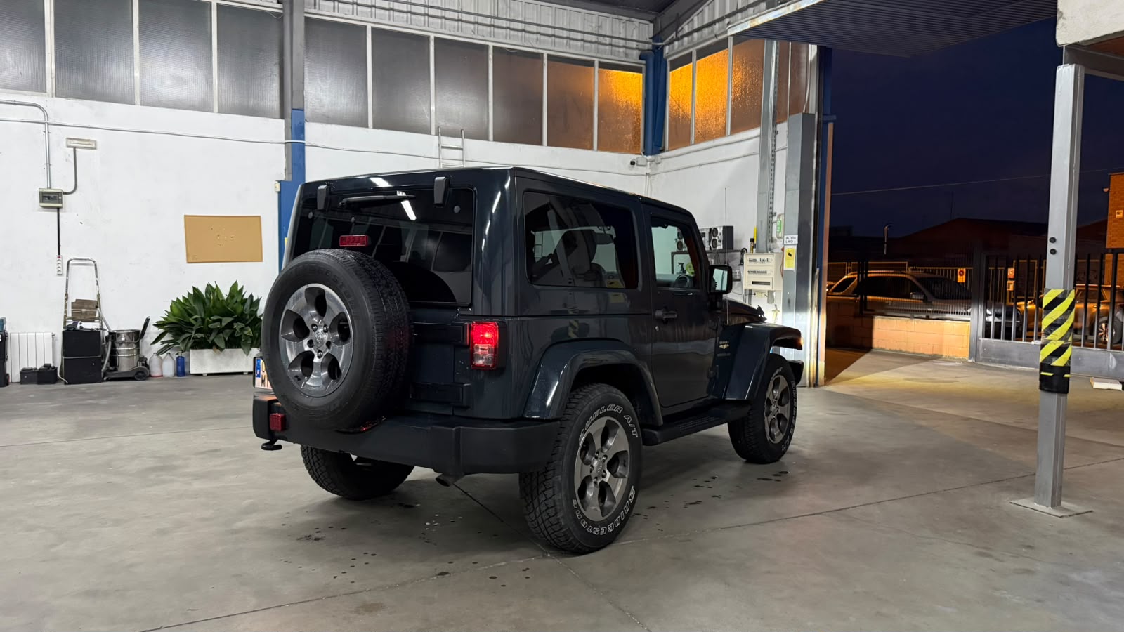 Jeep Wrangler Sahara rear three-quarter view